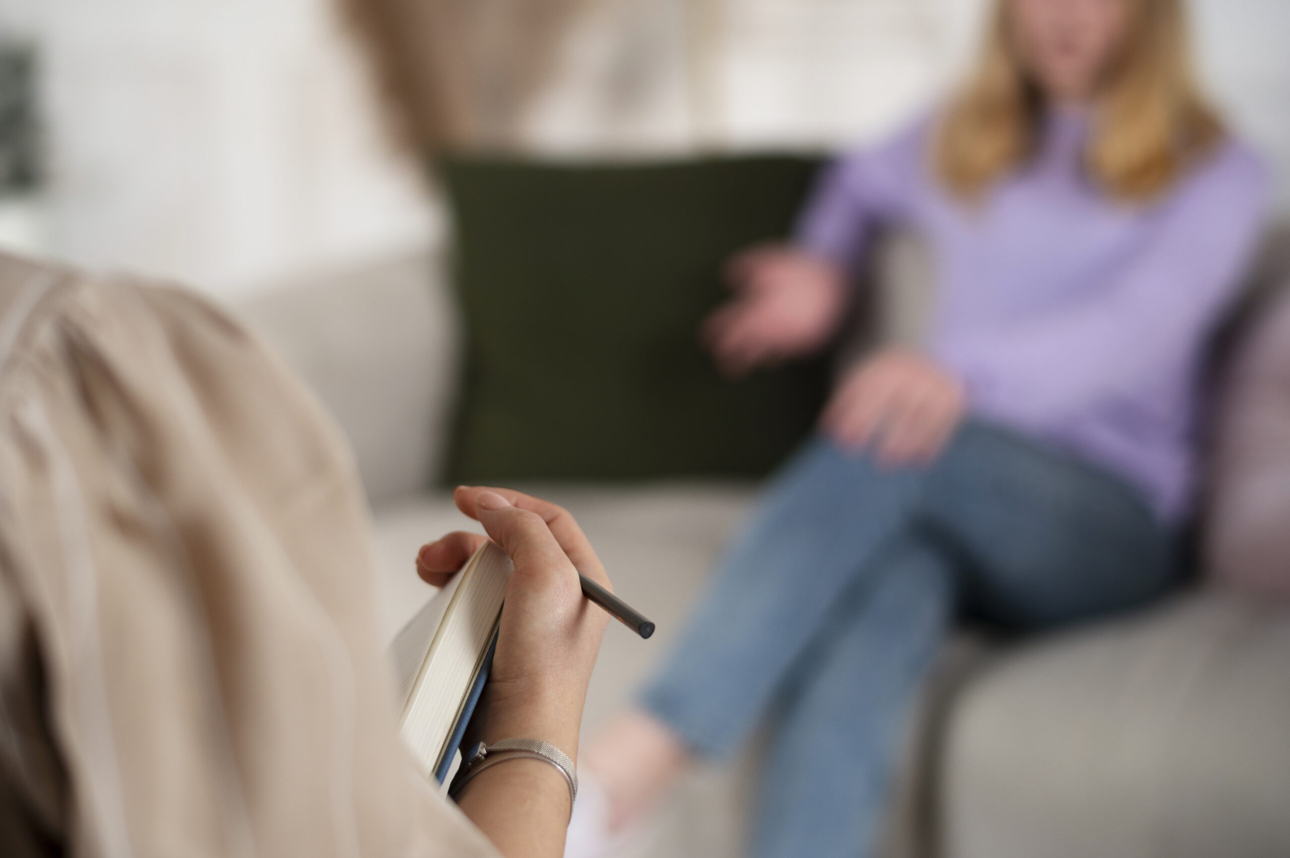sided-view-young-girl-talking-therapist-scaled.jpg